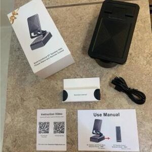 NIB  Adjustable Cell Phone Stand with Wireless Speaker with remote control.